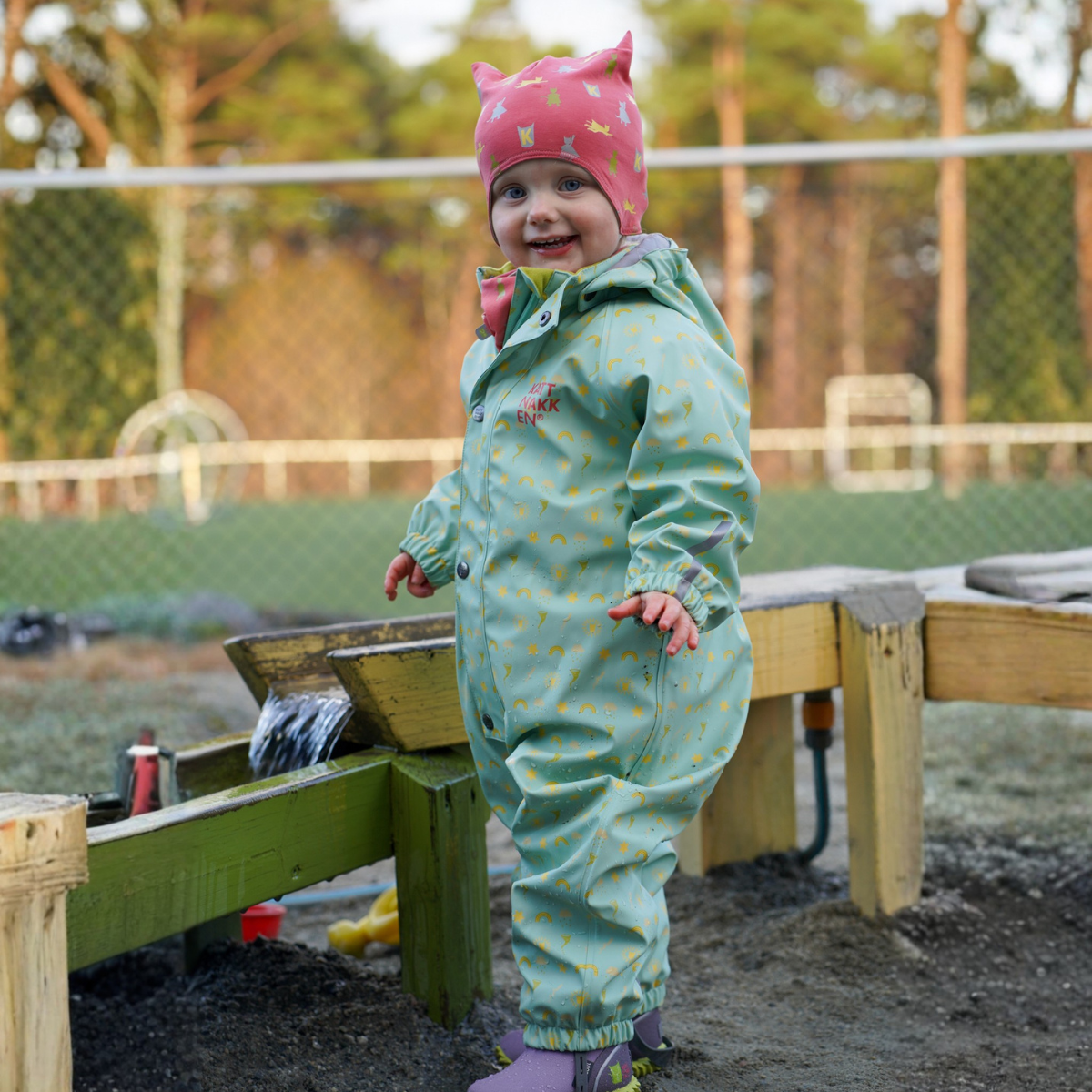 Kattnakken - Babyregndress Dugg Jane Pistasj